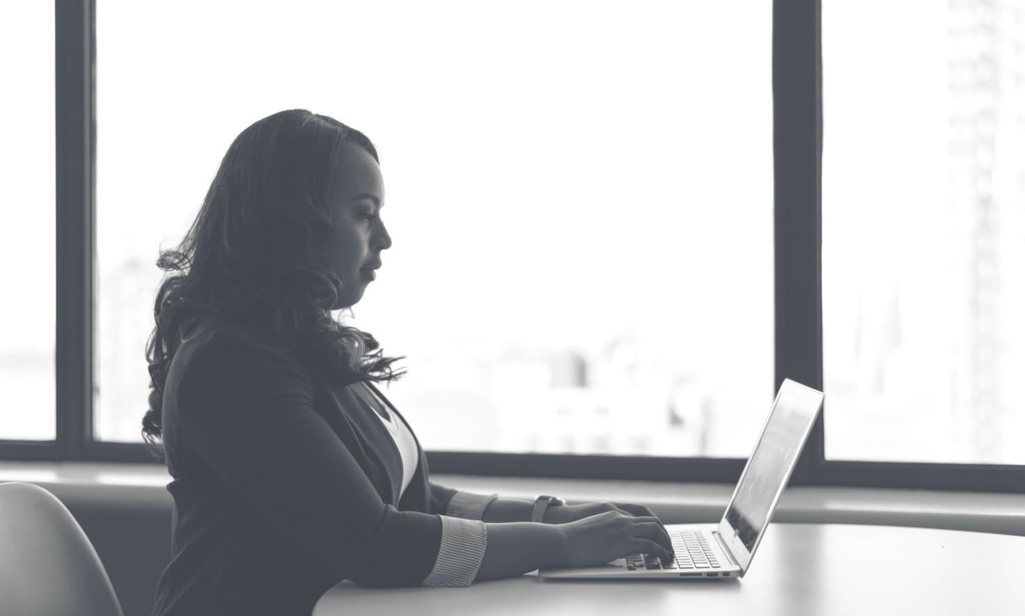 Modern server room with organized cable management and monitoring displays showing system performance metrics