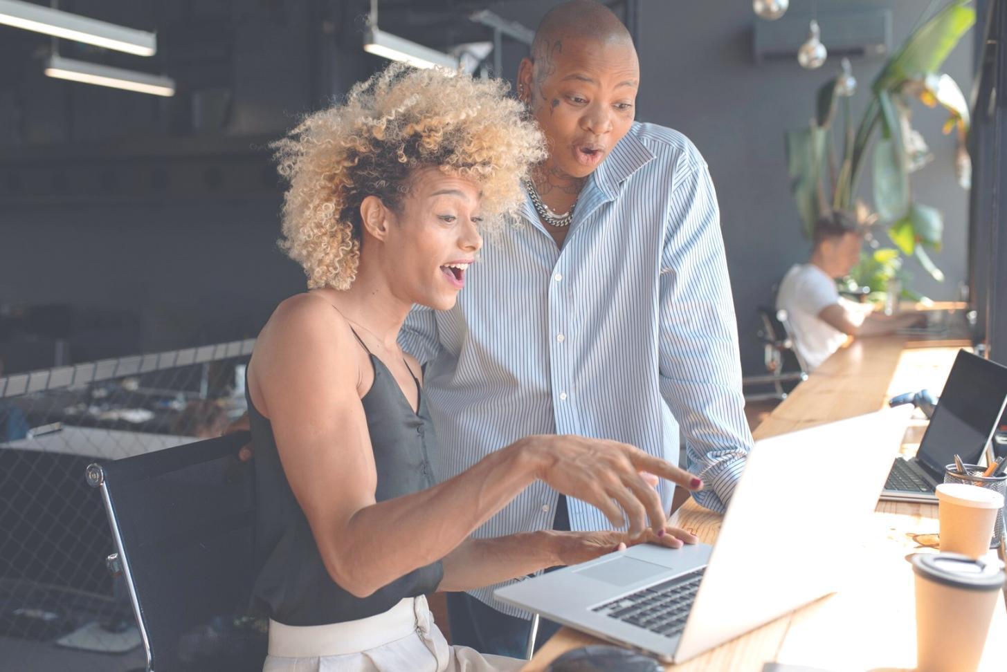 Students working on server configuration in modern lab setting